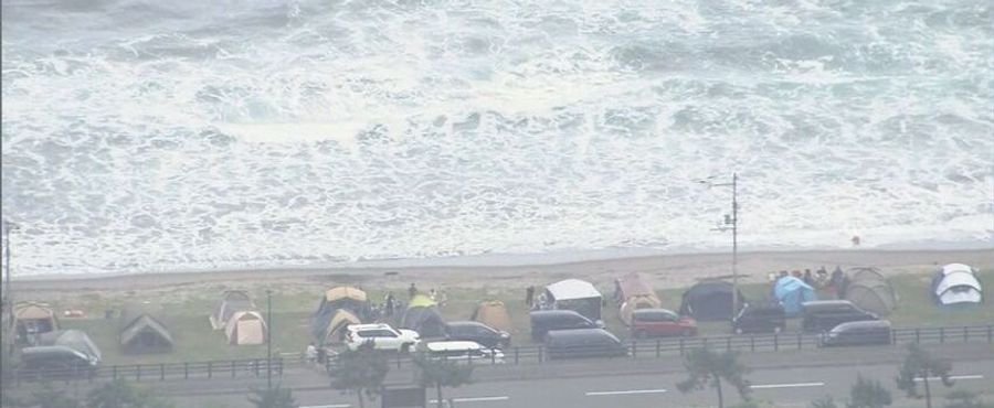 Brave Father Perishes Saving Two Children from Sea's Embrace